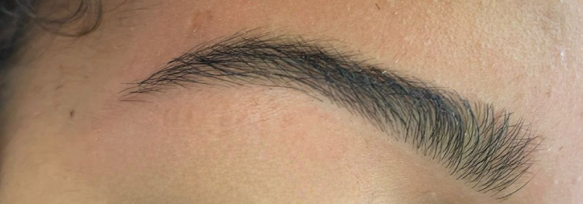 A freshly threaded and shaped brow